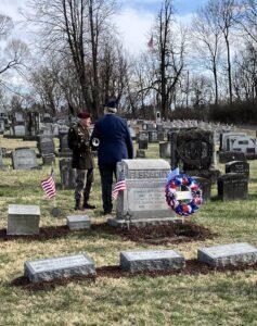 Wreath, flag, and GAR marker at gravestone